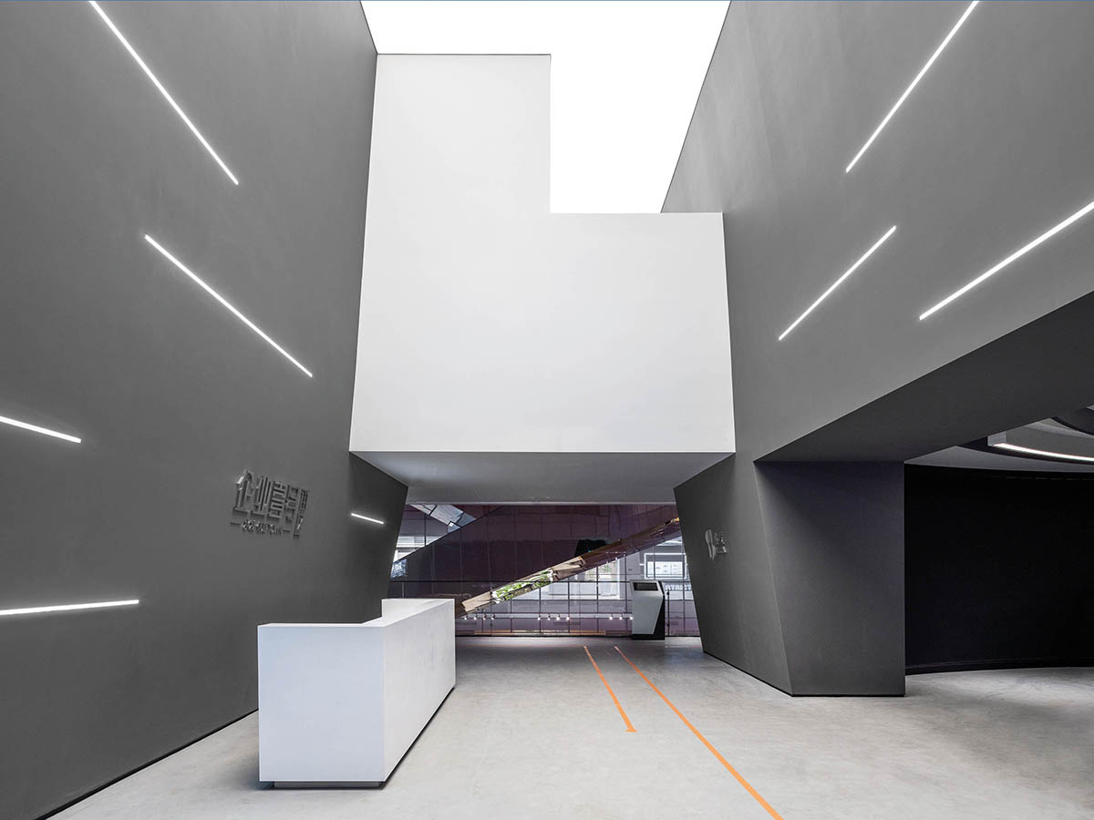 aoe built ShuiFa Info Town Property Exhibition Centre with all-white perforated volumes in China