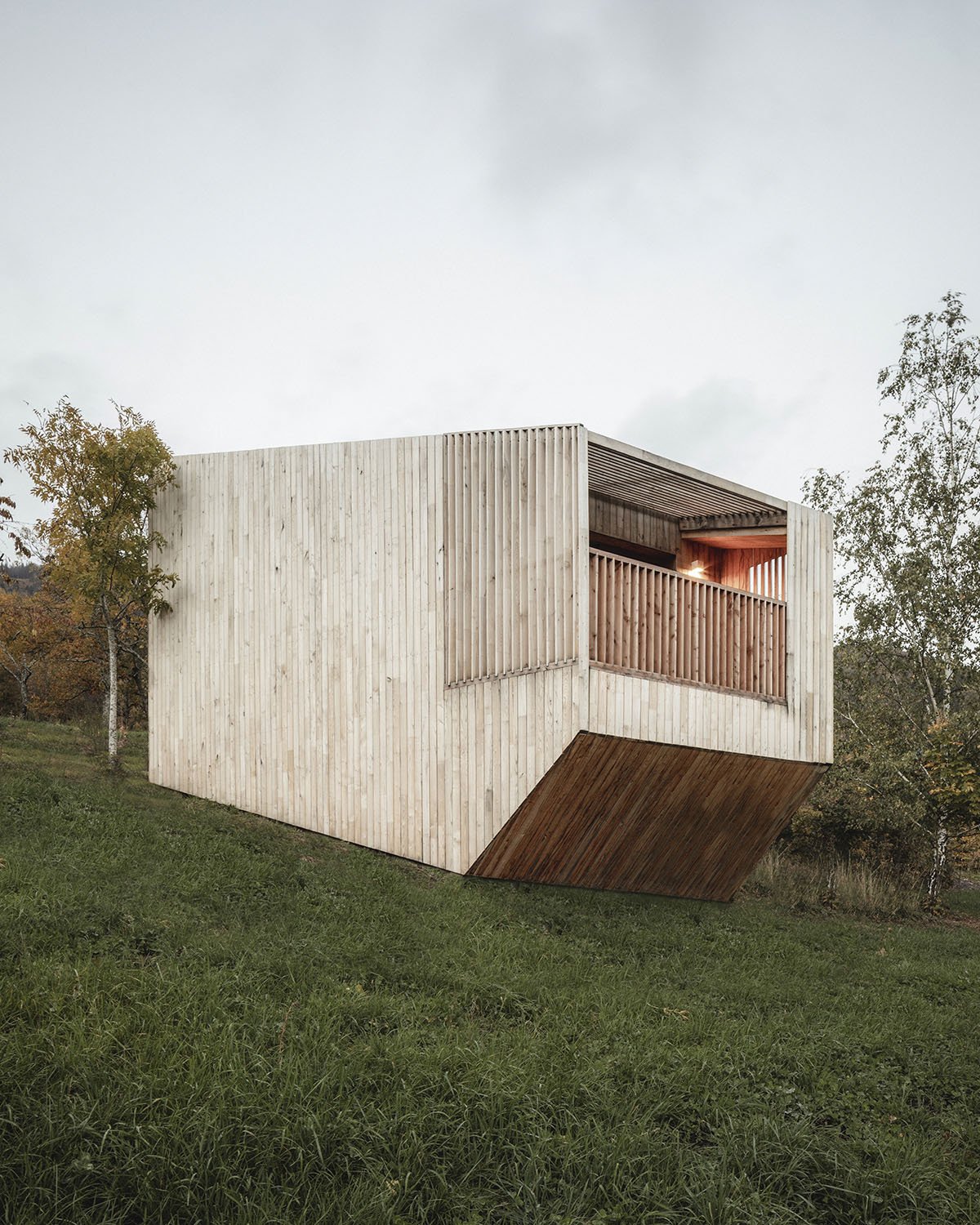 Reiulf Ramstad Architects scatters 14 wooden hotel cabins on hillside of Breitenbach, France