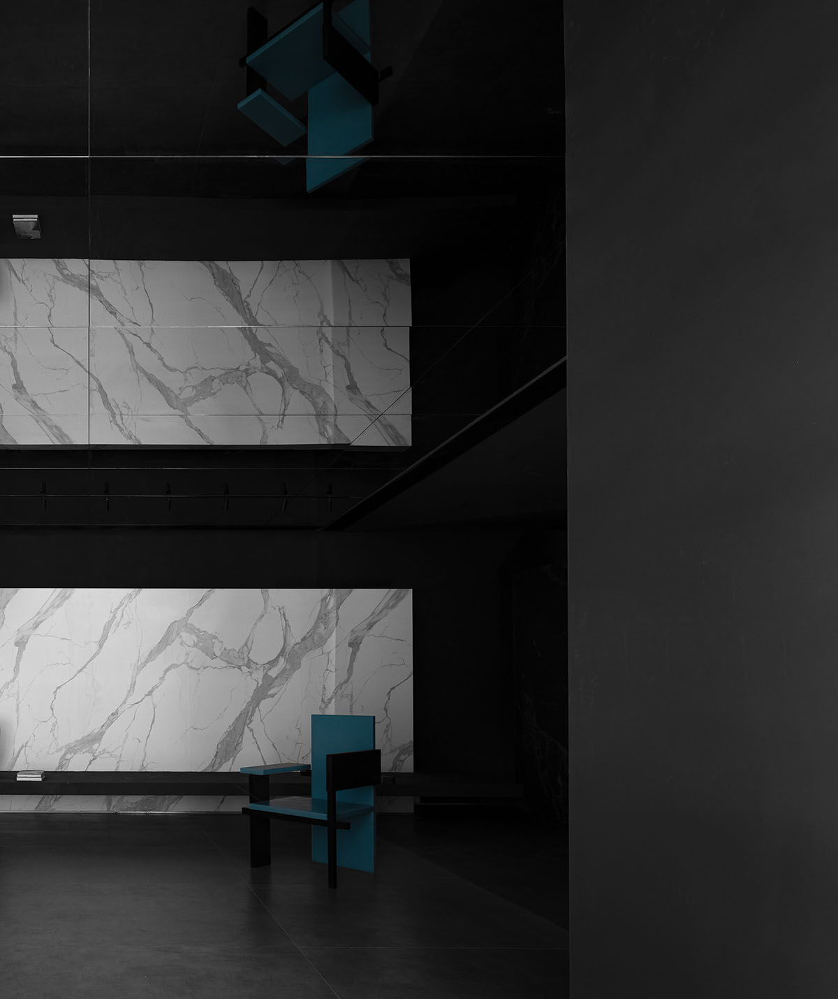 AD ARCHITECTURE creates dark interiors for showroom playing with light and sharp geometries in Foshan