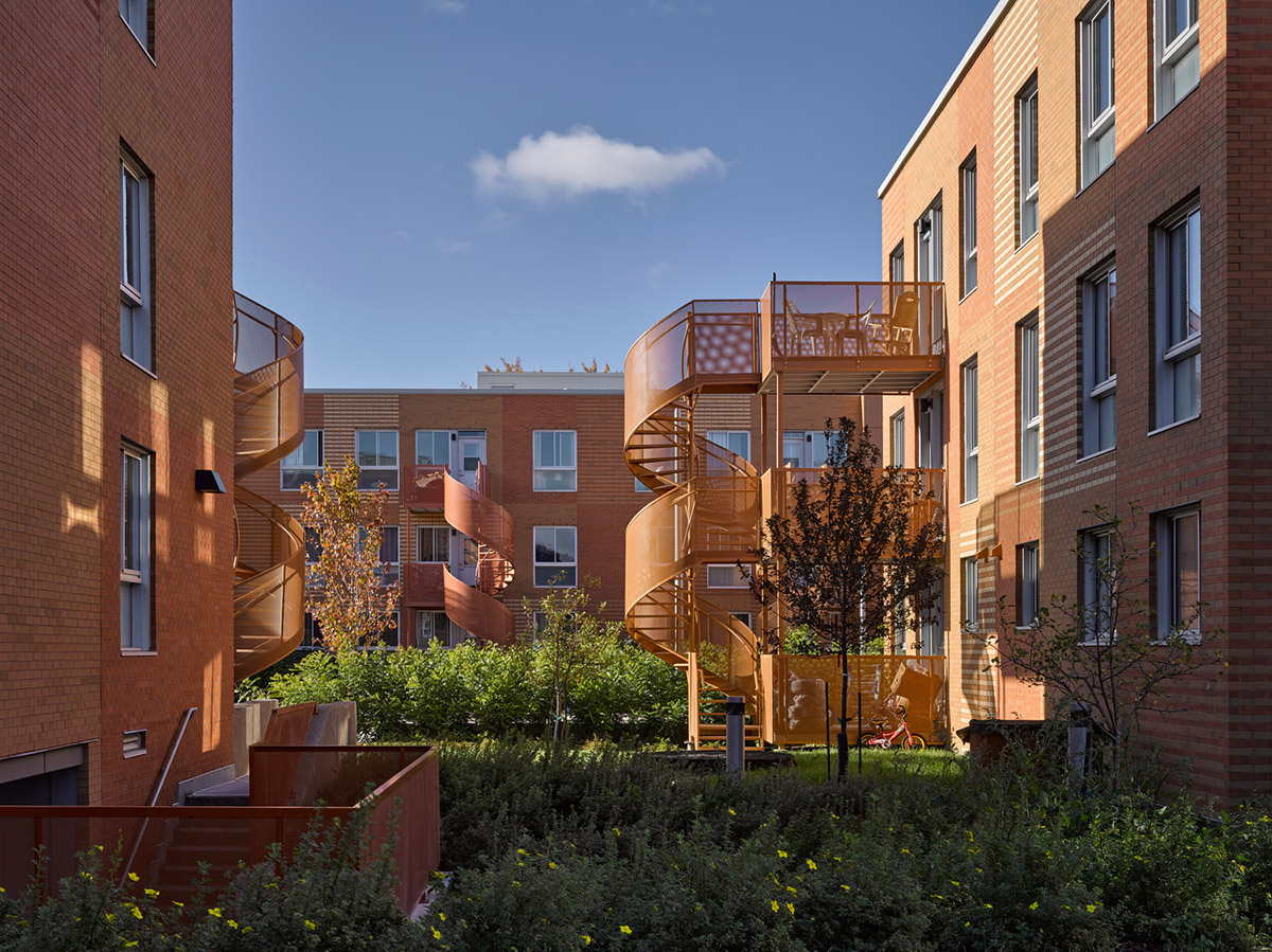 Saia Barbarese Topouzanov renovates 1970s housing complex with spiral staircases in Montréal