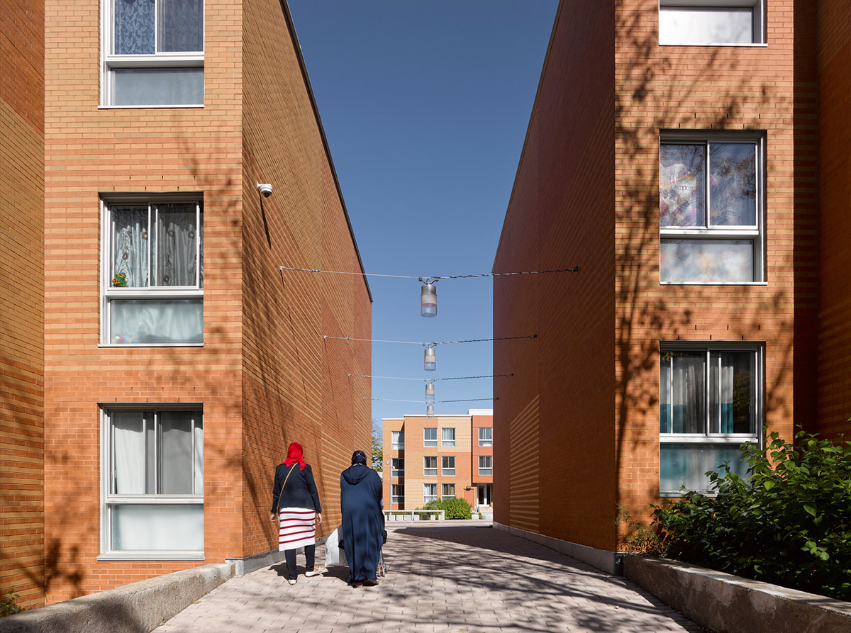 Saia Barbarese Topouzanov renovates 1970s housing complex with spiral staircases in Montréal