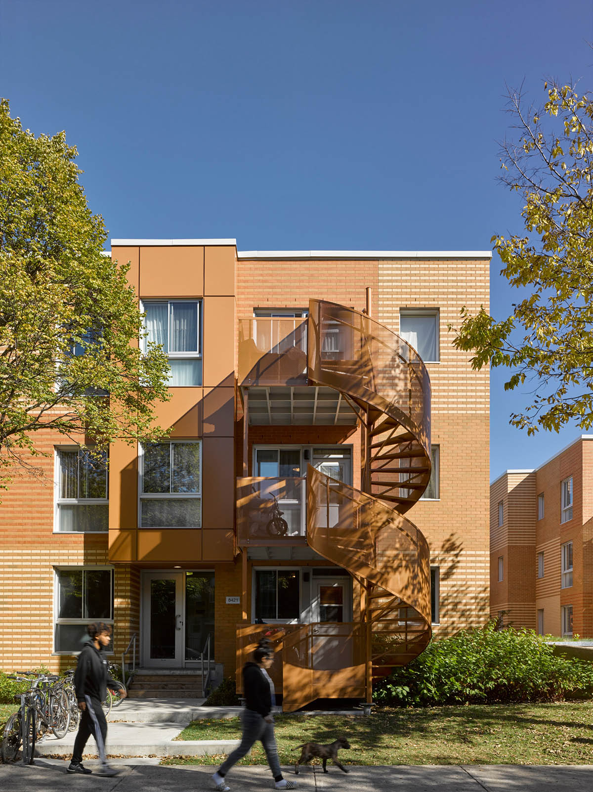 Saia Barbarese Topouzanov renovates 1970s housing complex with spiral staircases in Montréal