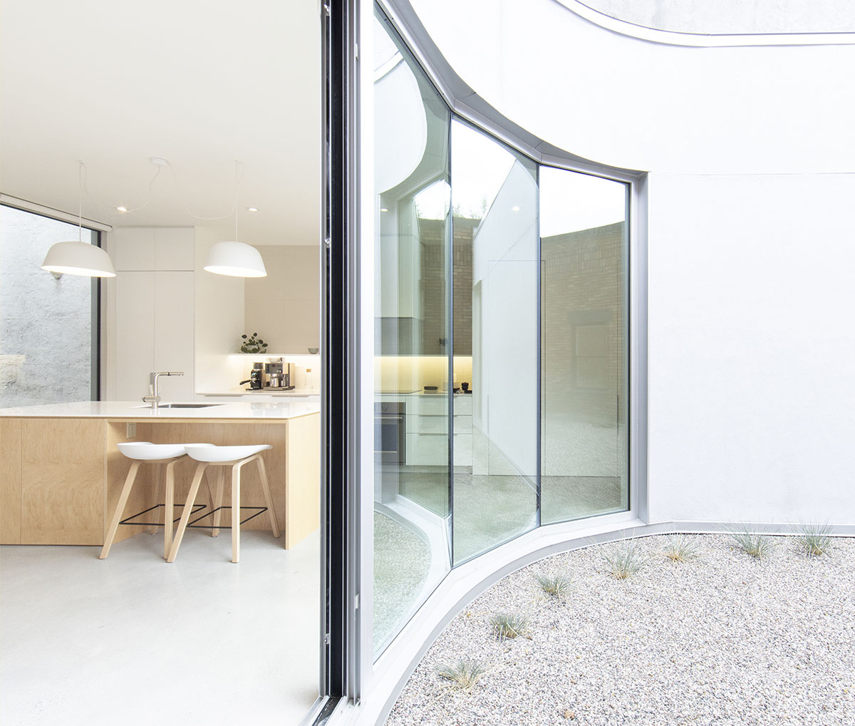 TBA adds curved and textured pale brick volume to Montreal’s heterogenous family neighborhood