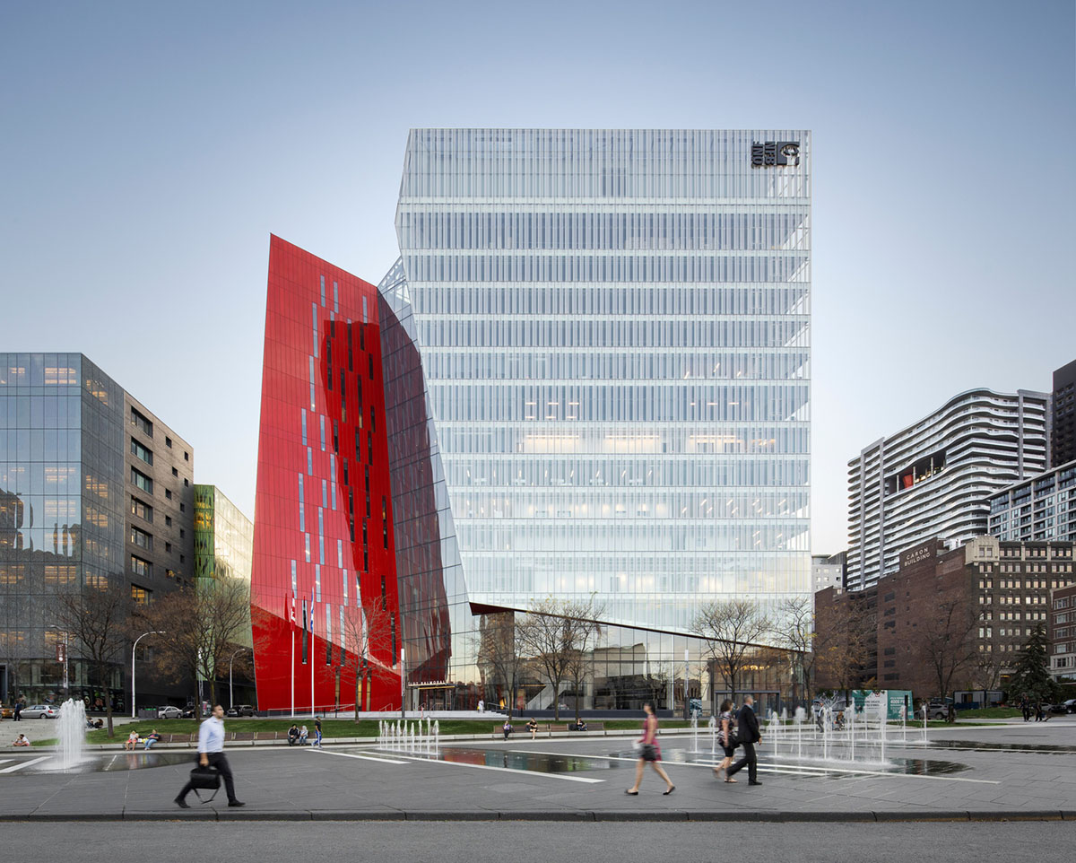 Provencher_Roy carves mixed-use office tower in Montréal with a red-colored diagonal slit
