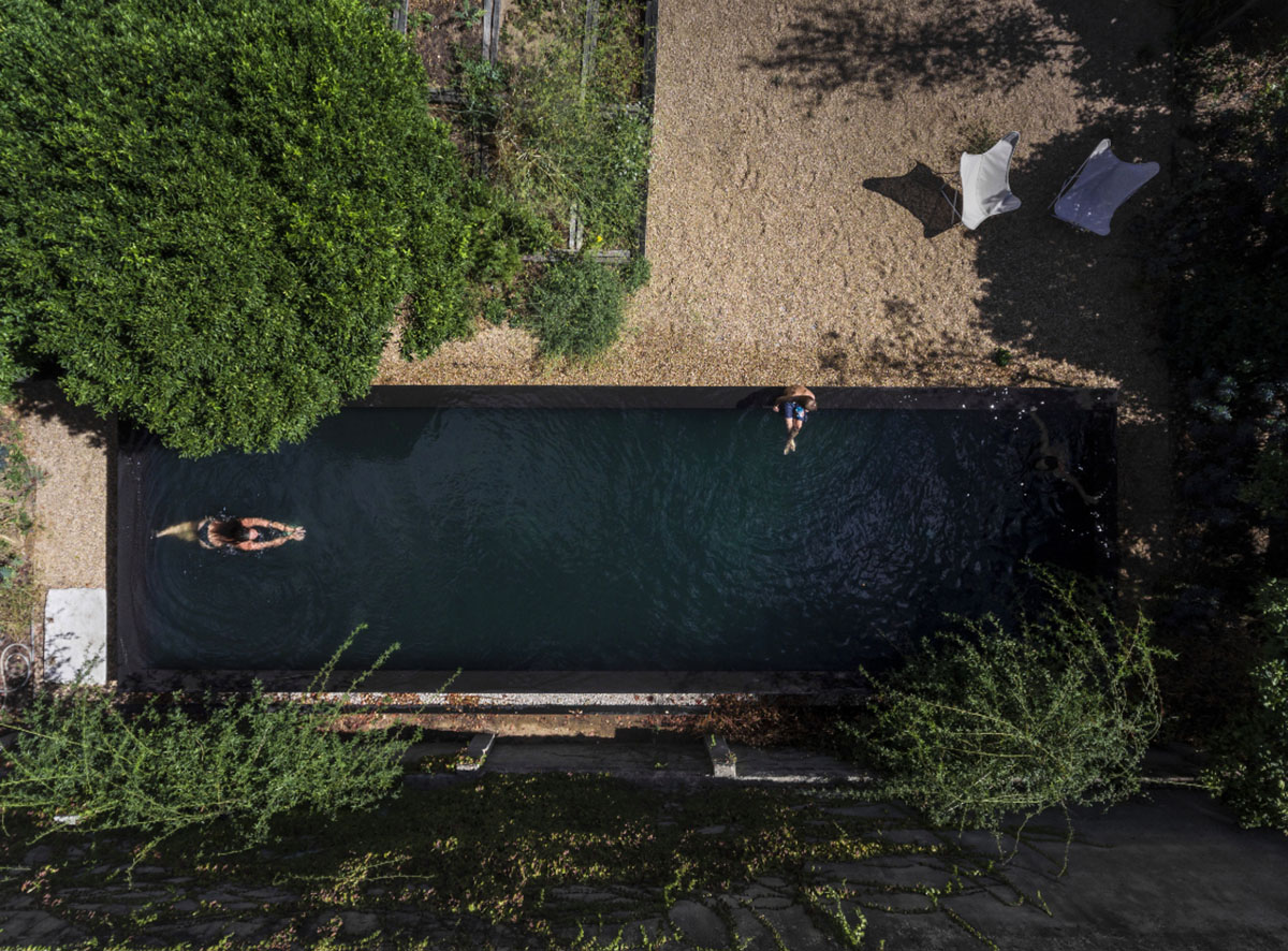 Extrastudio converted former winery in Portugal  into a new family home with red mortar walls