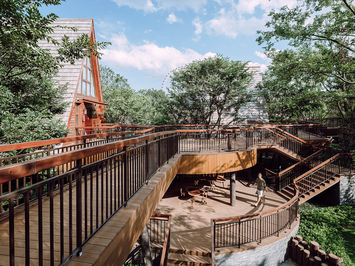 13 hotel cabins by aoe are plugged in trestle bridge that allows minimum footprint among lush trees