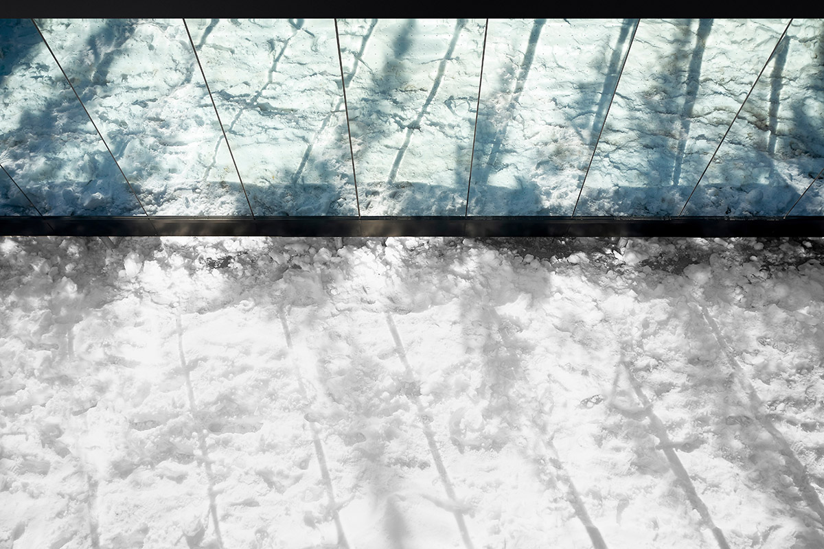 Bourgeois / Lechasseur architects built black wooden holiday cabin with mirrored façade in Québec