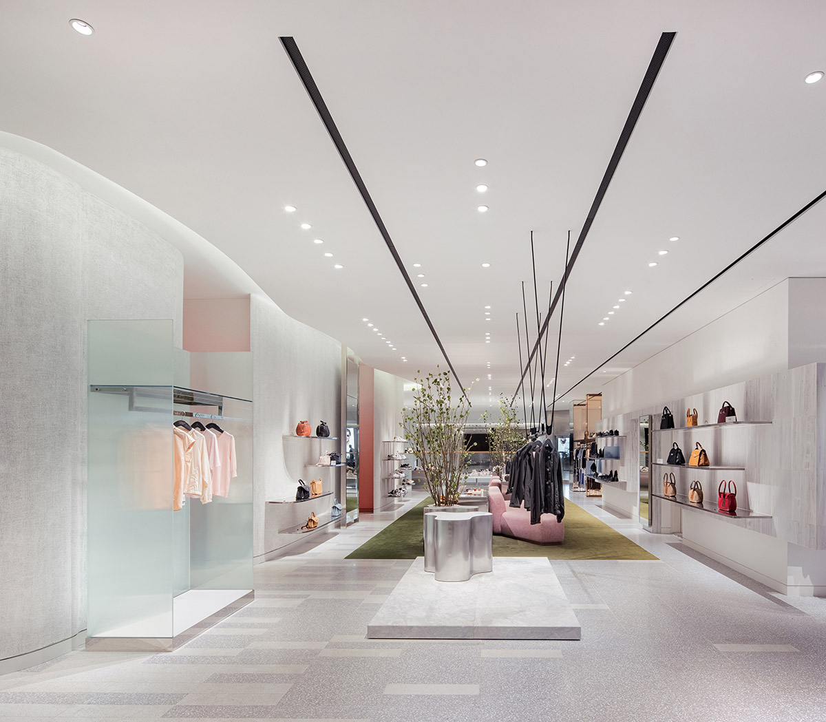 Burdifilek designs gallery-like interiors spaces featuring metallic surfaces and fluid forms