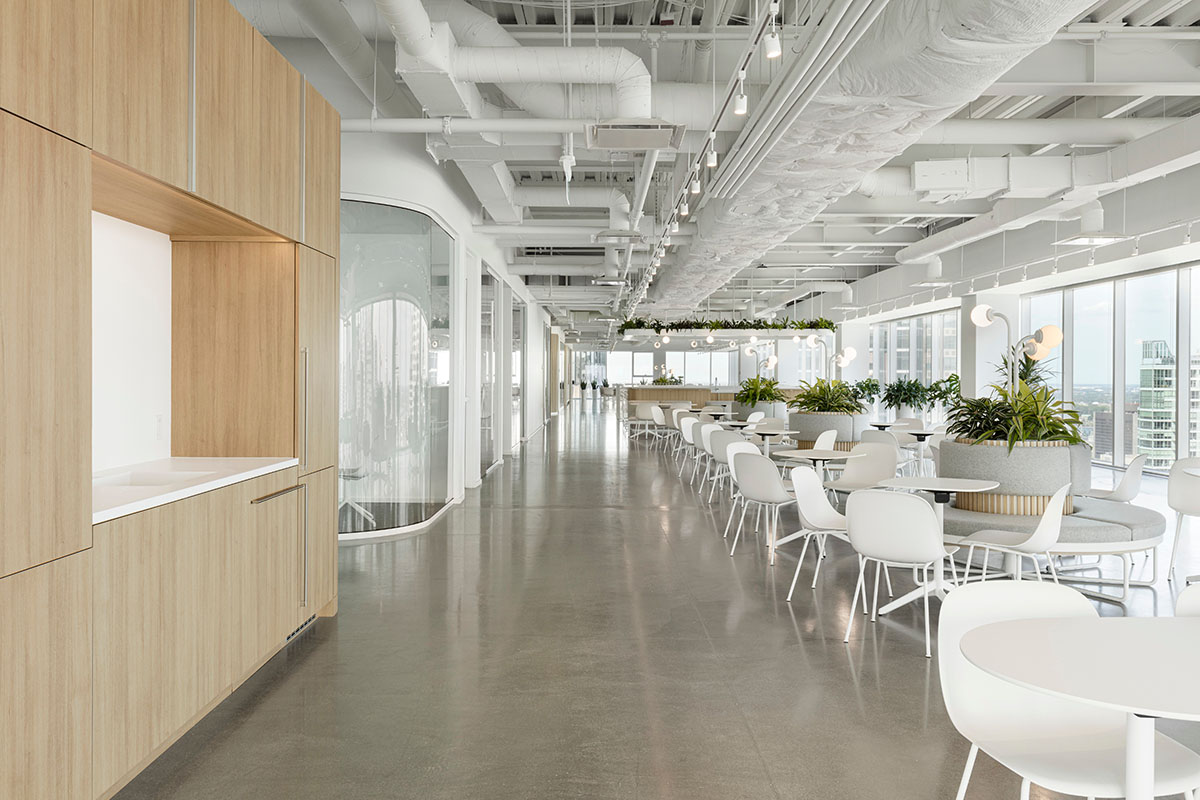 ISSADESIGN merges linear elements and curved working pods for interiors of Behavox in Montreal