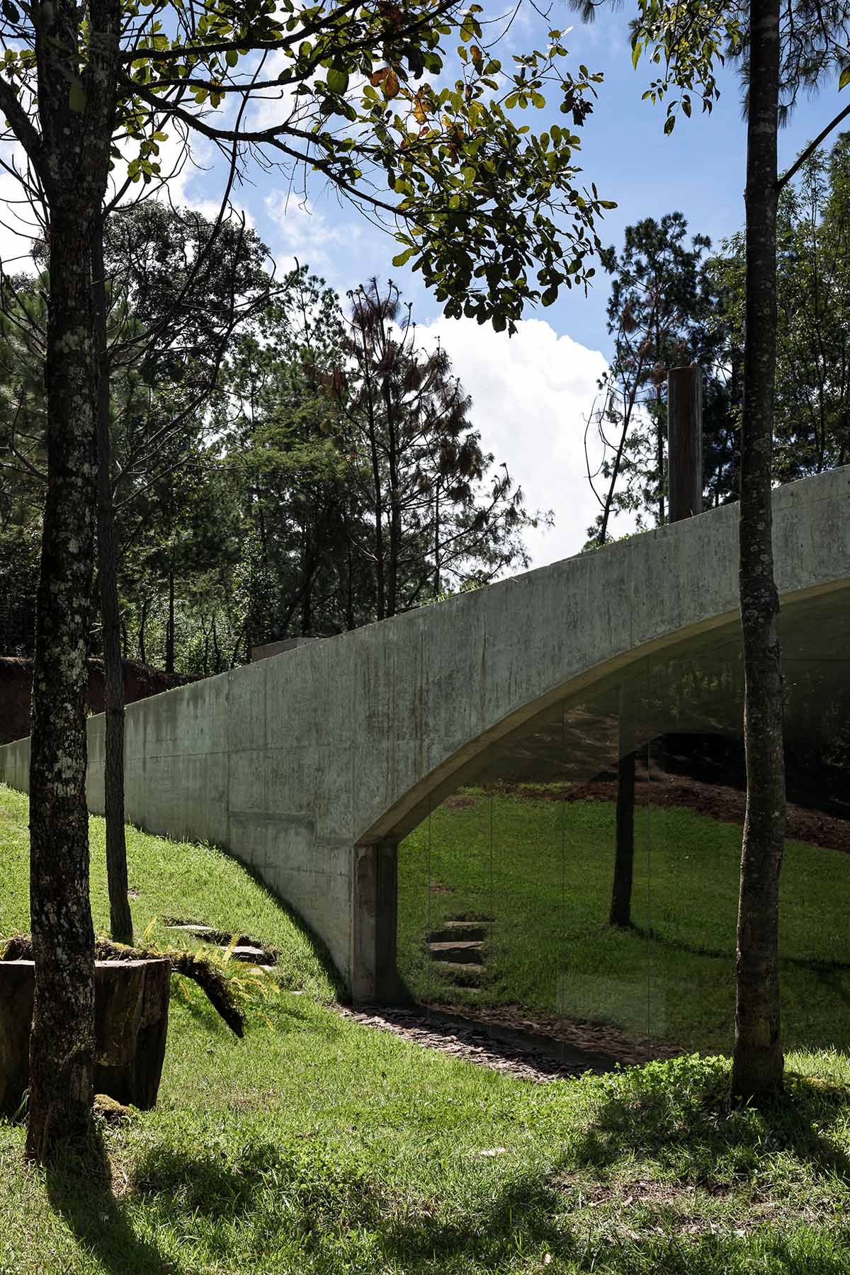 HW Studio designs cozy cave that disappears in the landscape and creates a new hill in Mexico