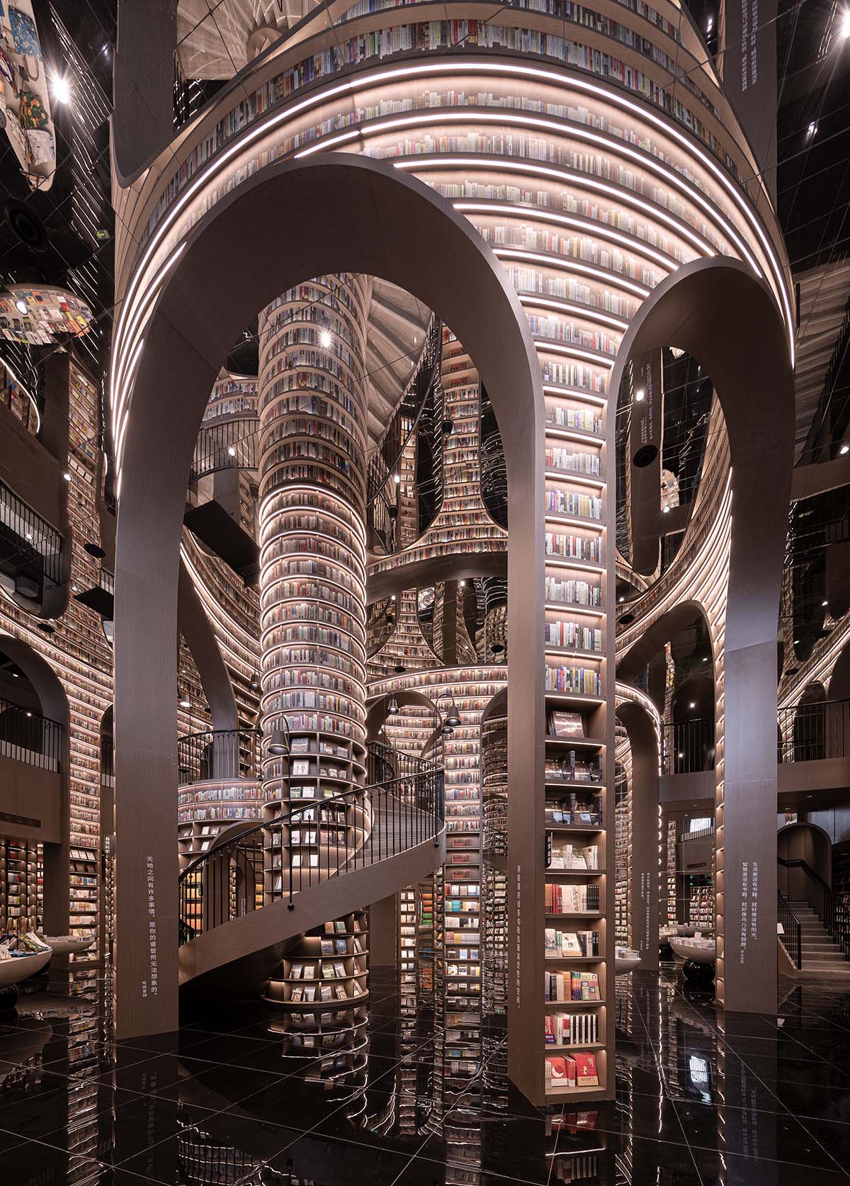 Reading a book is like stepping into a bamboo forest made of endless bookshelves designed by X+Living