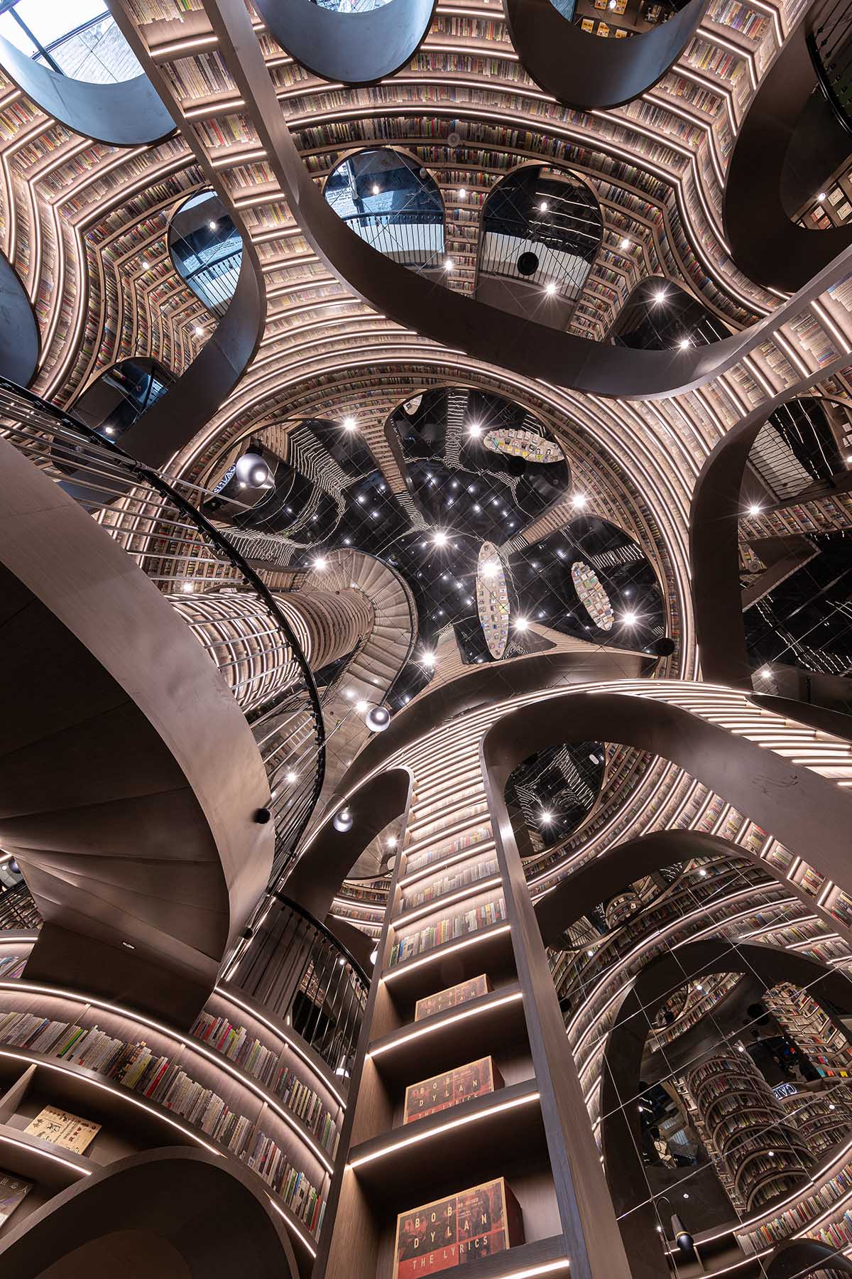 Reading a book is like stepping into a bamboo forest made of endless bookshelves designed by X+Living