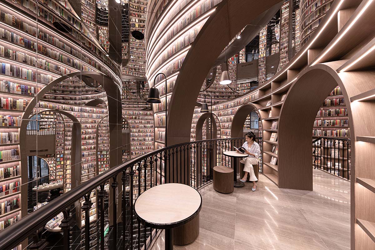 Reading a book is like stepping into a bamboo forest made of endless bookshelves designed by X+Living