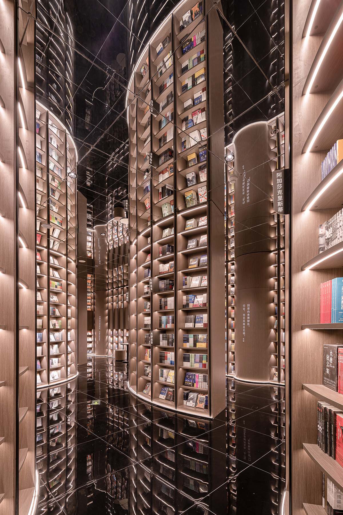 Reading a book is like stepping into a bamboo forest made of endless bookshelves designed by X+Living
