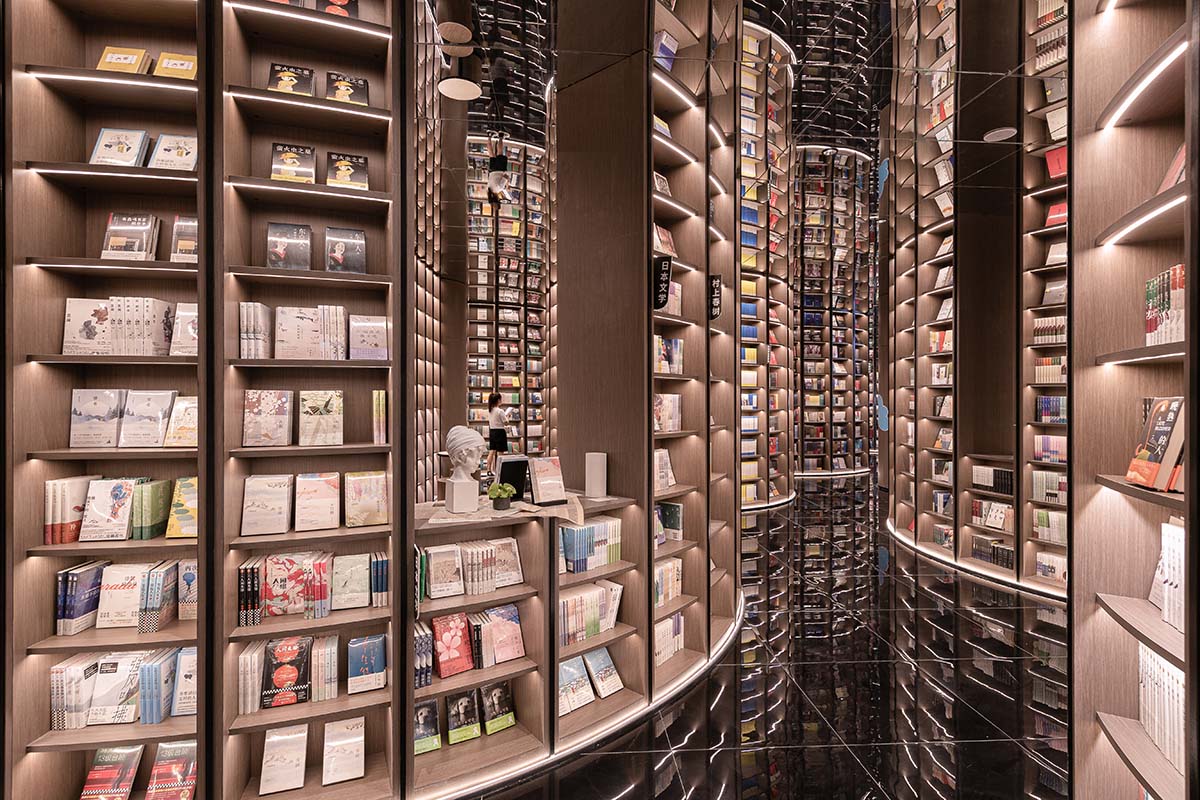 Reading a book is like stepping into a bamboo forest made of endless bookshelves designed by X+Living