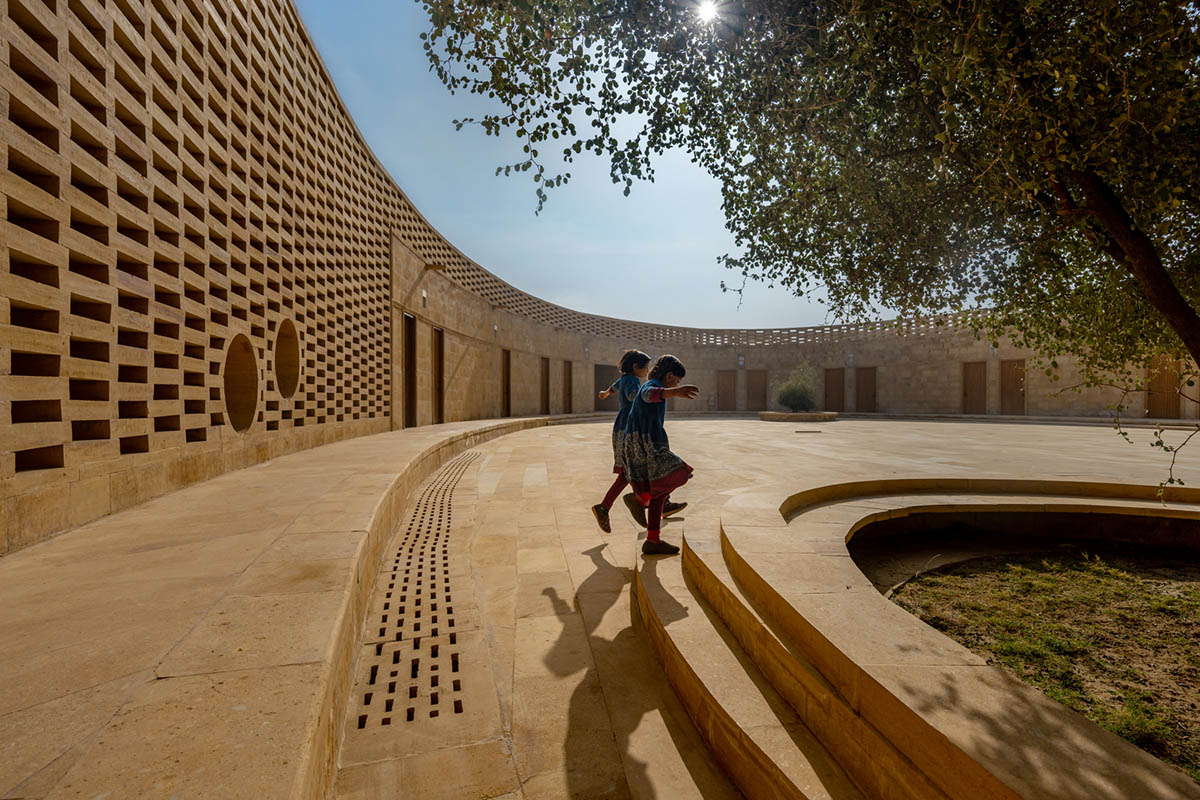 Diana Kellogg Architects' oval-shaped girl's school is made of hand-carved sandstone in rural India