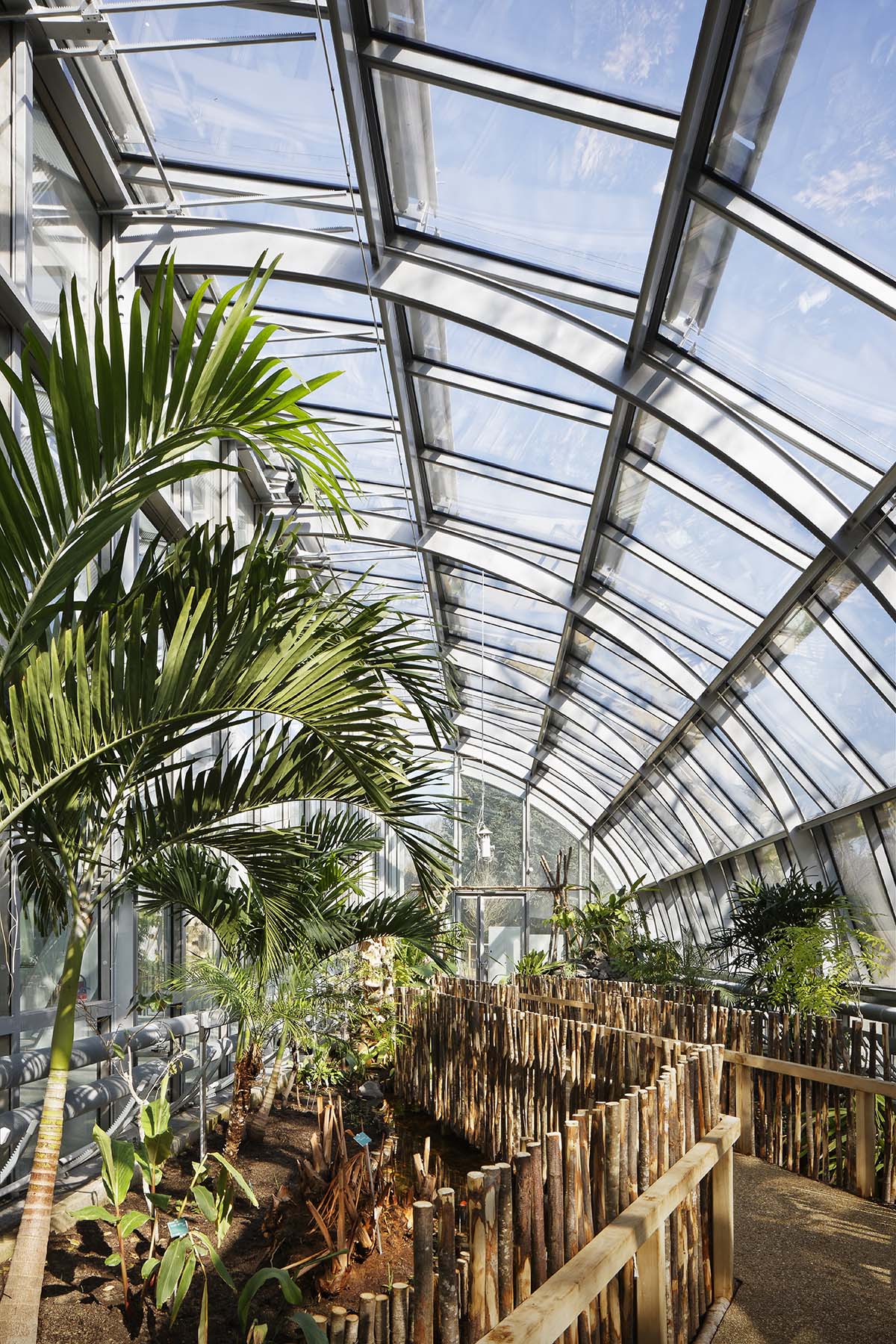 Marc Mimram built greenhouses in all sides of a tennis stadium to attract different audiences