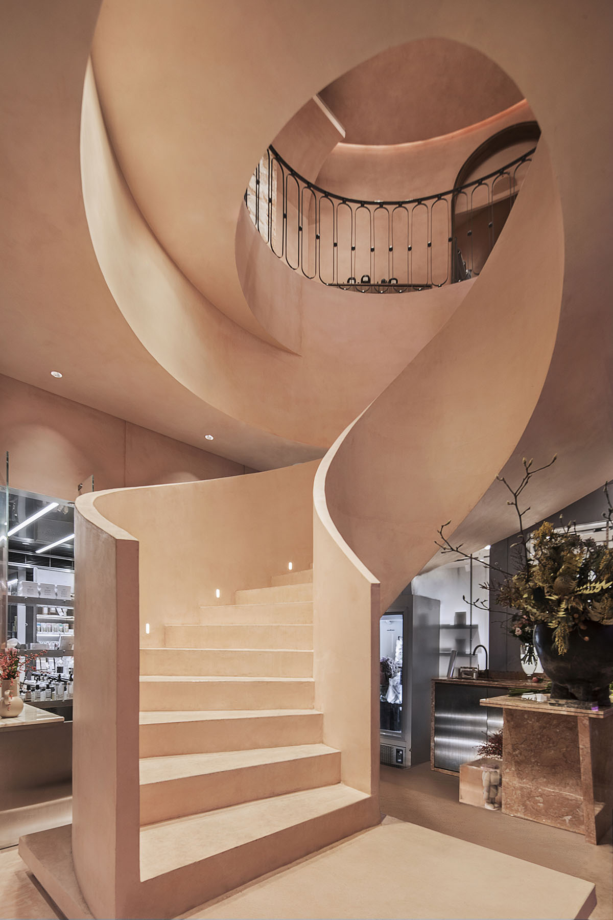 S&ograve; Studio combines metallic and pinkish-colored interior for Beijing store