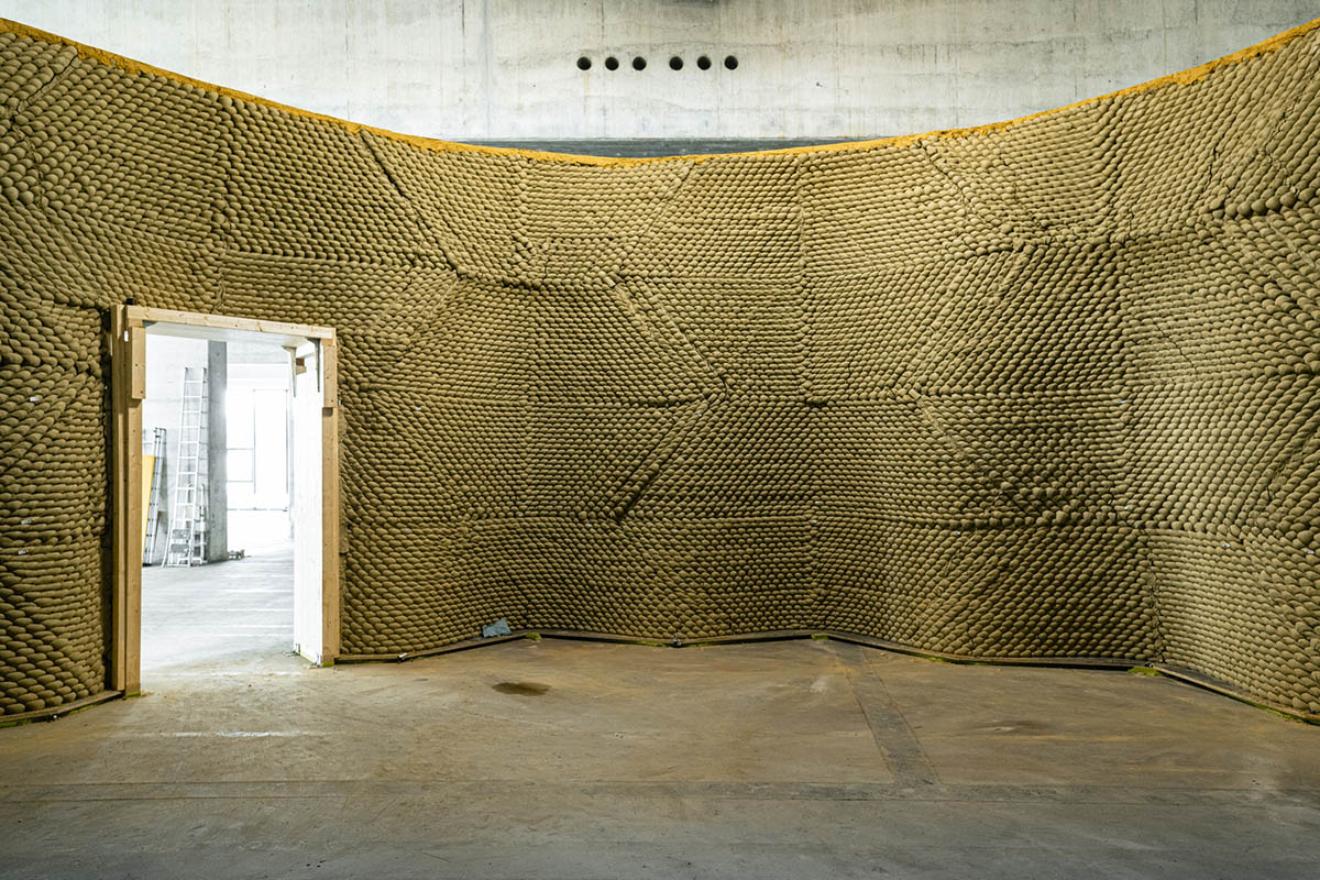 Gramazio Kohler Research used 30,000 soft clay bricks to install undulating clay rotunda in Bern