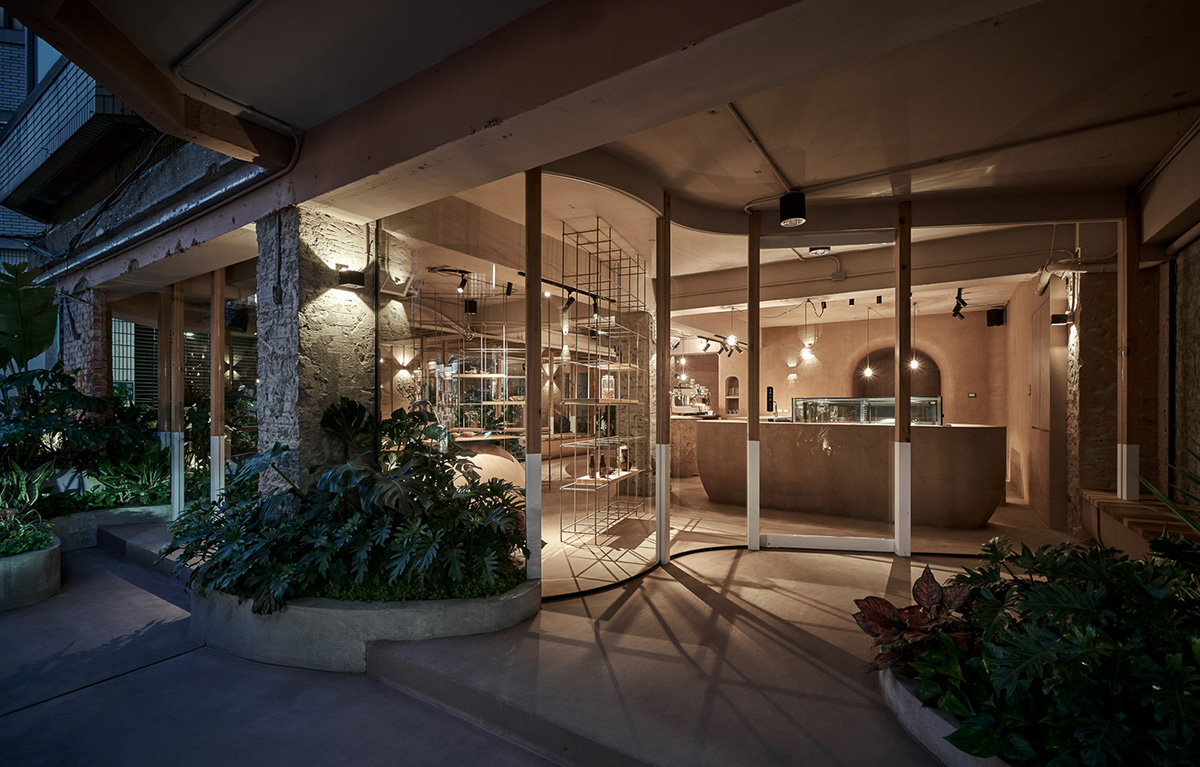 Soar Design Studio adds greenery and smooth surfaces to chocolate store offering garden-like space
