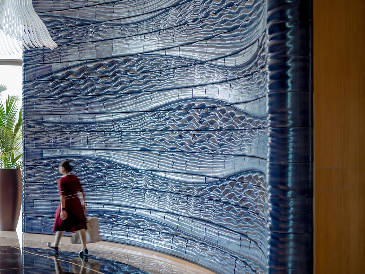 Studio RAP wraps the entrance of a hotel with majestic 3D printed ceramic walls 