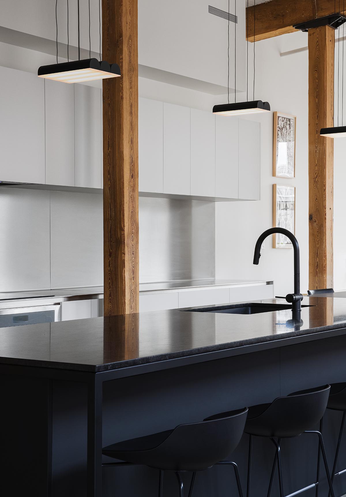 La Firme renovates historic mid-19th-century building with brick walls and oak cabinets in Montreal 