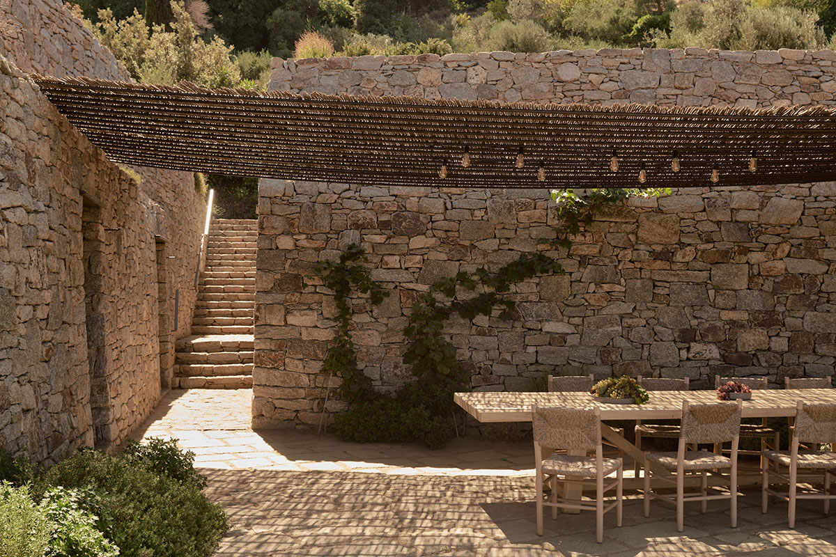 Terraced stonewalls sprawl down to offer an exploratory route in an old vineyard in Samos