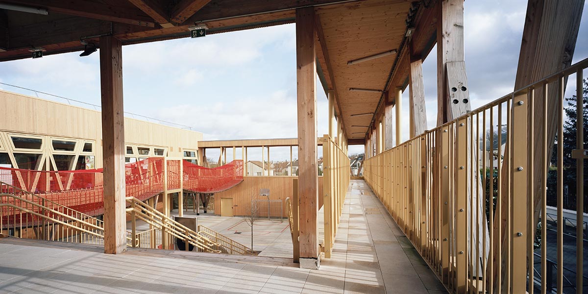Wooden school by r2k architecte is inspired by Nordic architecture to be a positive energy building