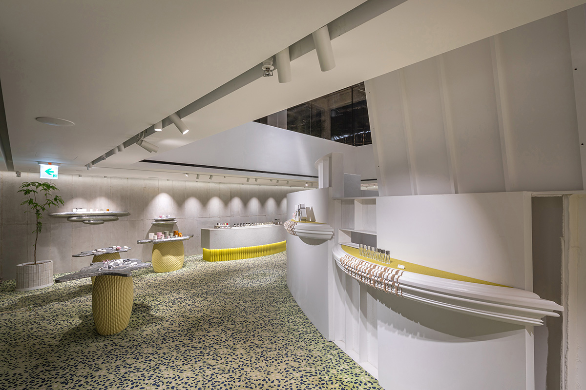 Perfume store by The System Lab shows the beauty of scent with gridded concrete and glass box