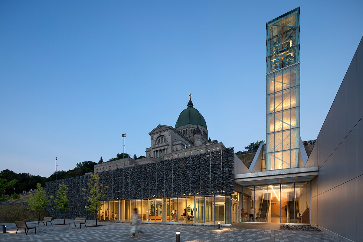 A striking bell tower pierces the sky, illuminating the grandeur of the pavilion in Montreal