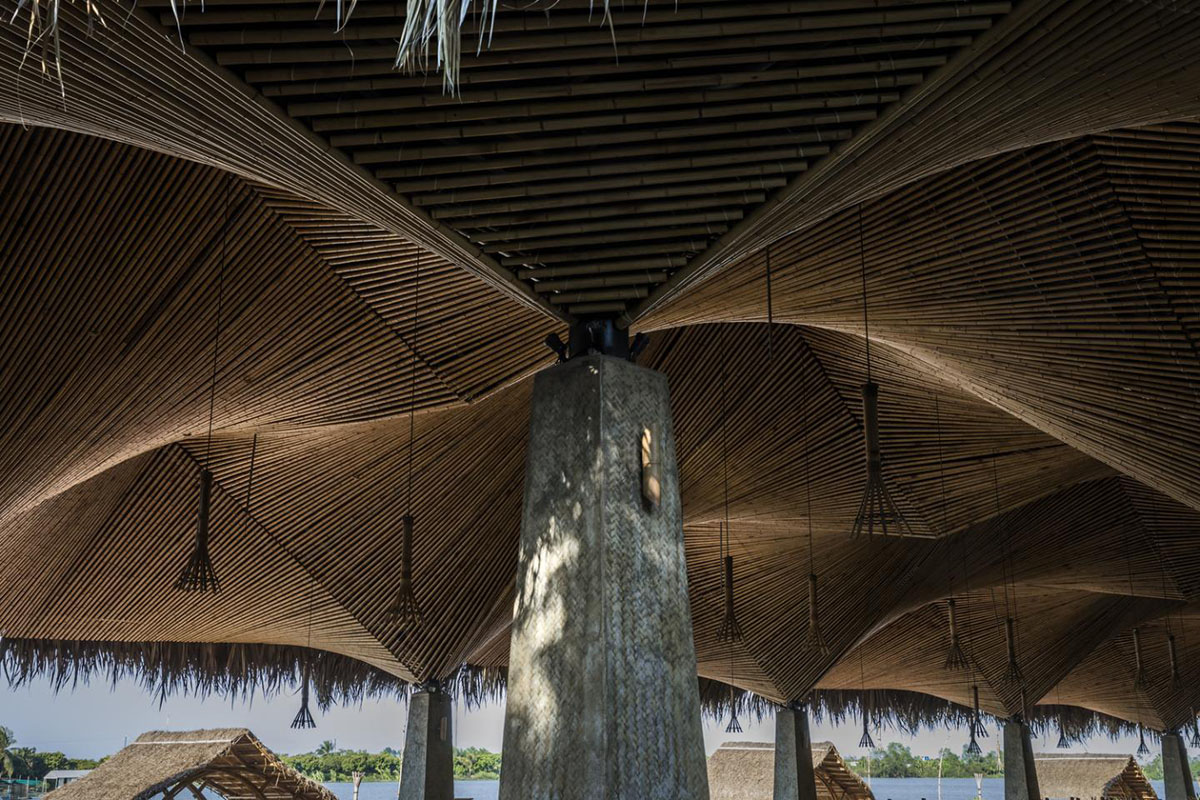 DDconcept Architecture uses coconut leaves and bamboo to create undulating restaurant in Vietnam