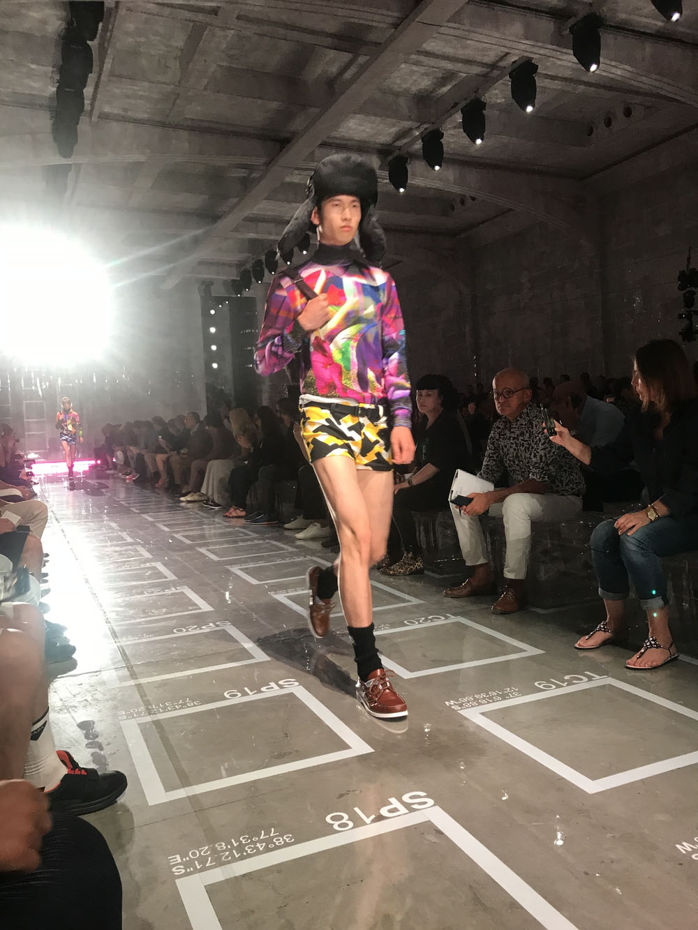 AMO filled Prada's fashion show stage with purple-lit inflatable stools