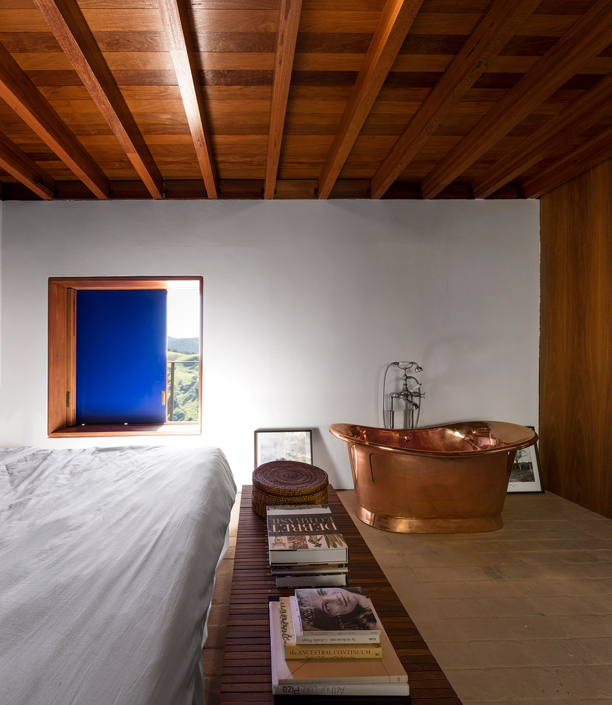 Narrow wooden Catu&ccedil;aba House by Studio MK27 produces its own energy on a valley of S&atilde;o Paulo