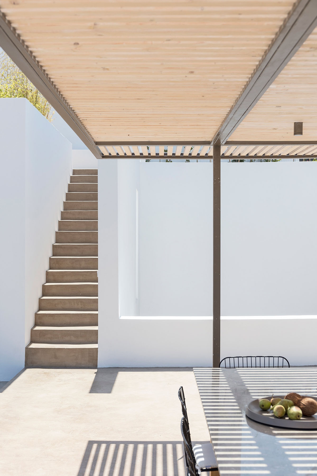 Kapsimalis Architects adds this summer villa featuring orthogonal lines to the Santorini Island