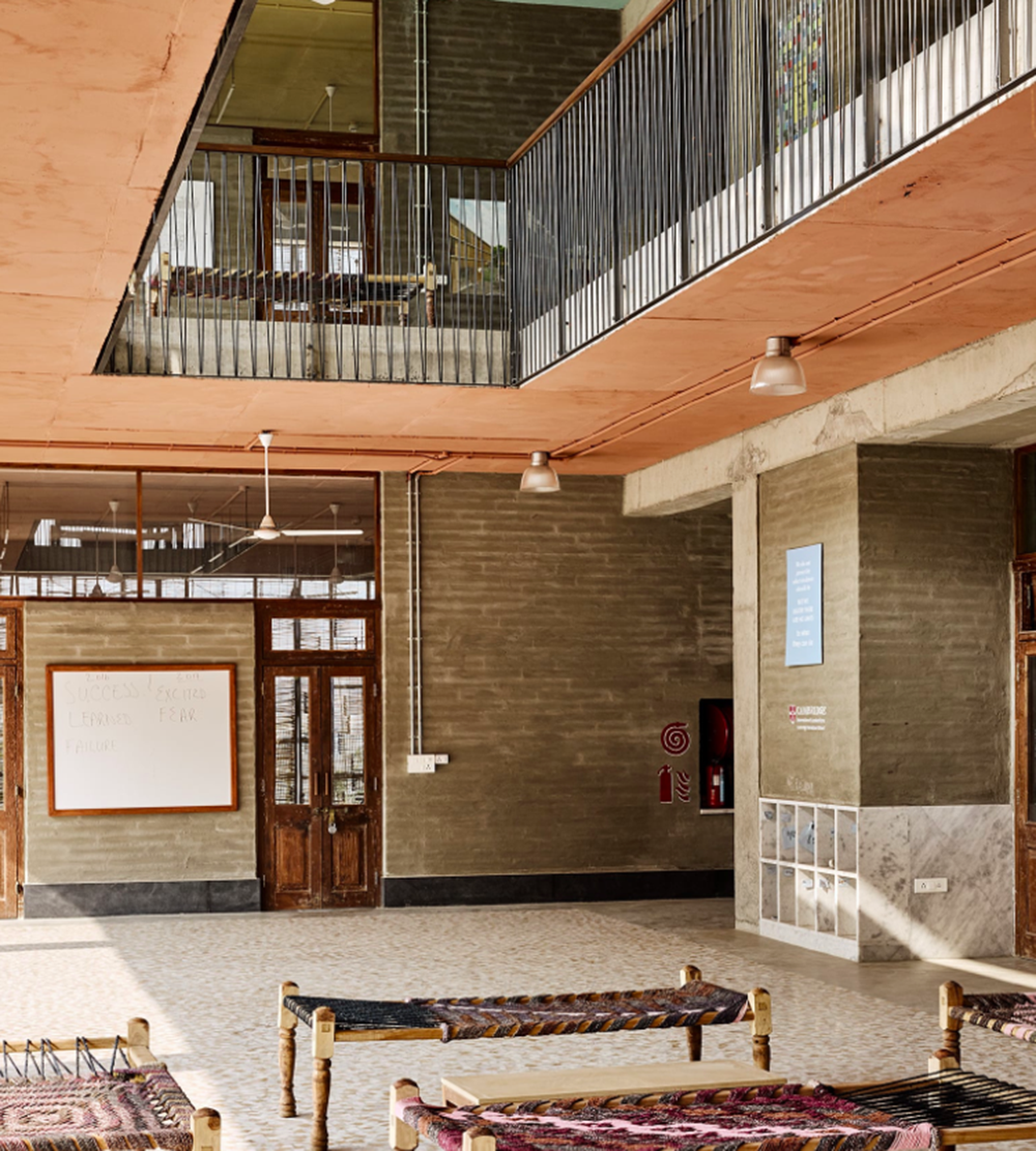 Avasara Academy, resembling an unfinished structure, educates young women in the moorland of Pune