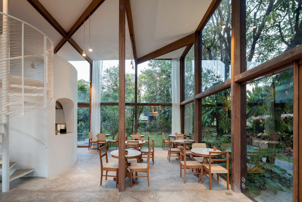 NitaProw designed an elegant transparent beauty shop within coconut trees of  Thonglor in Bangkok