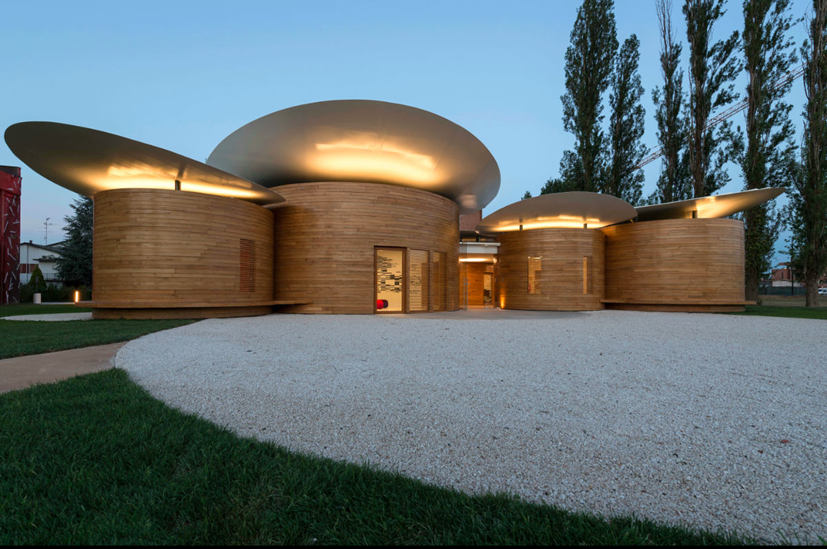 Nine wooden circular music boxes by MCA placed on the former Lamborghini manufacturing site in Italy