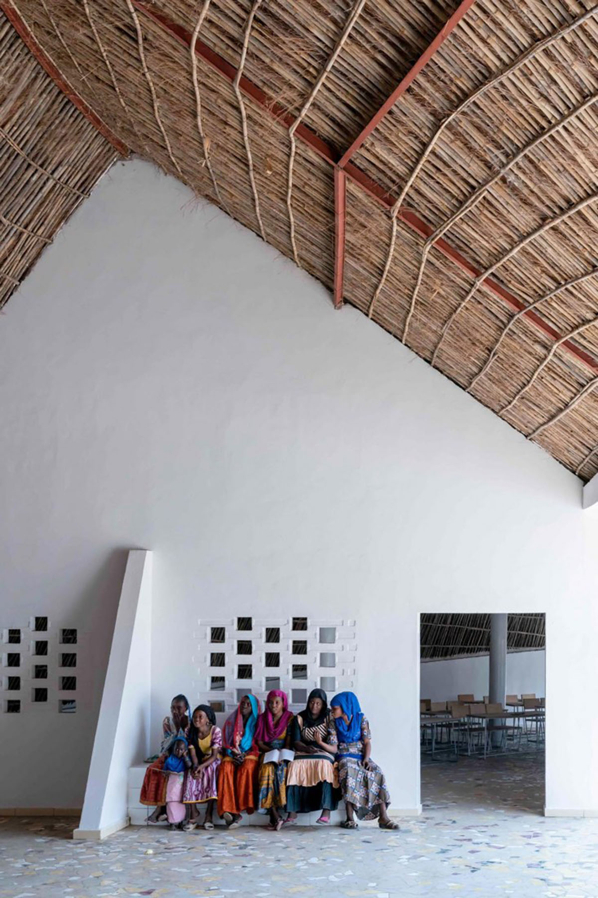 Toshiko Mori built Fass School and Teachers’ Residence featuring wavy thatched roof in remote Senegal
