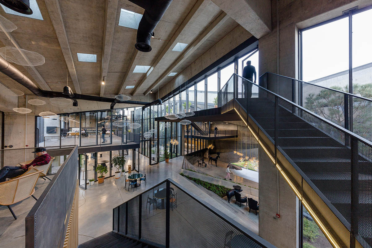 Folded concrete shell wraps coffee production plant by Giorgi Khmaladze Architects in Tbilisi