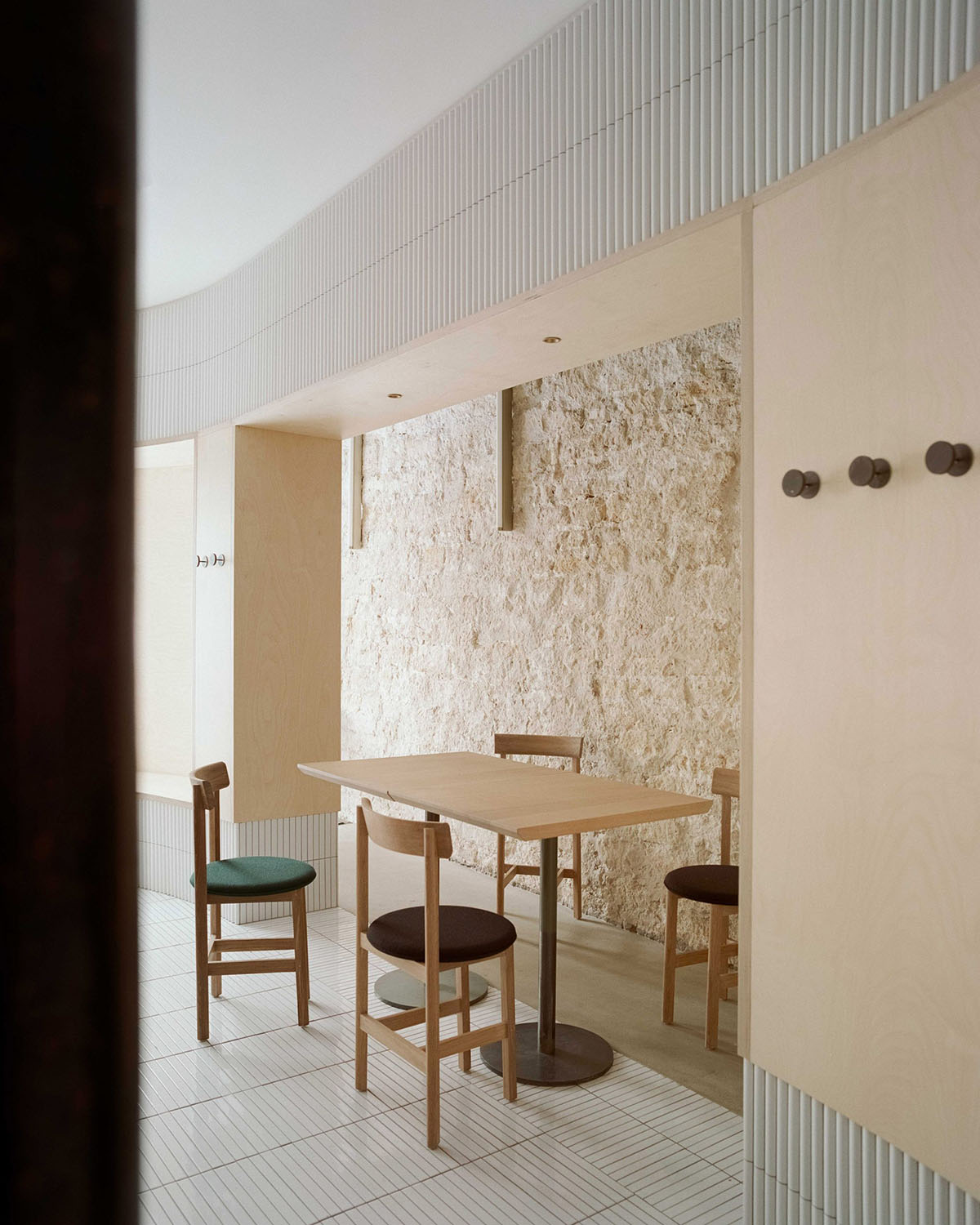 Neri&Hu-designed restaurant in Paris exposes layering material history with oblong volume inside