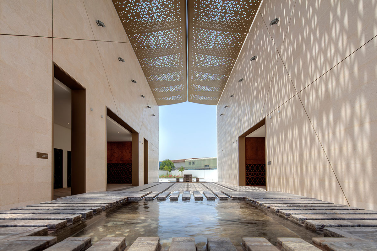 Dabbagh Architects builds mosque with perforated façade for controlled light evoking a sense of calm