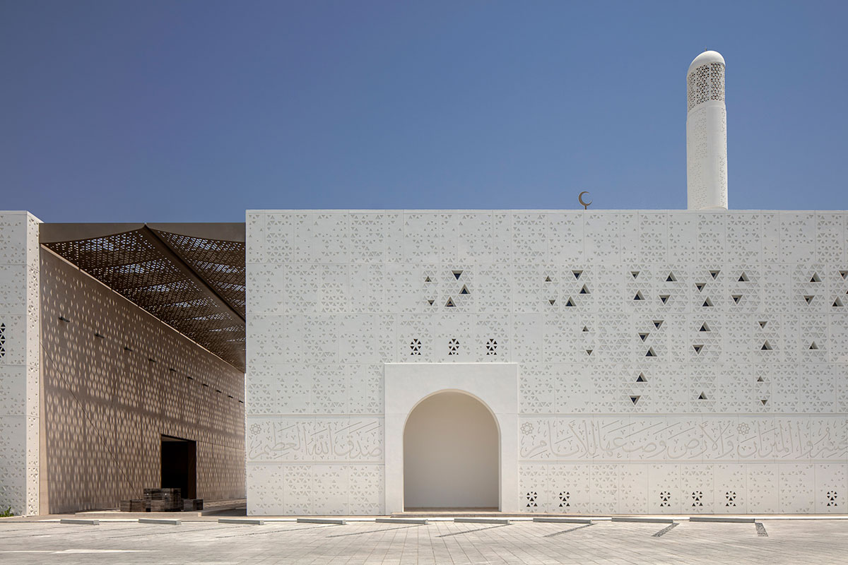 Dabbagh Architects builds mosque with perforated façade for controlled light evoking a sense of calm