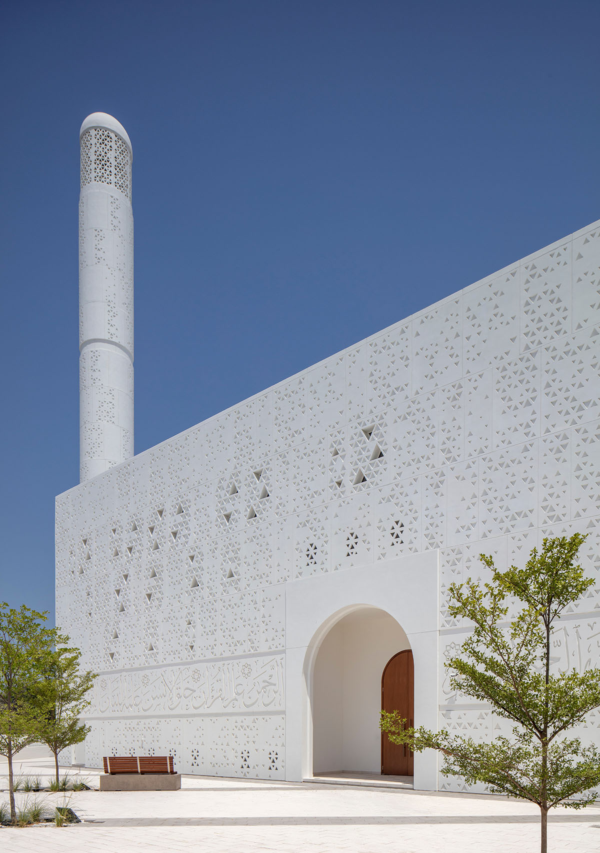 Dabbagh Architects builds mosque with perforated façade for controlled light evoking a sense of calm