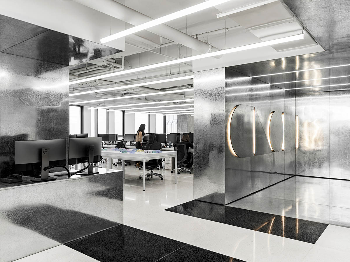CLOU architects designs brightly-lit interiors contrasting warm tones for its Beijing office 