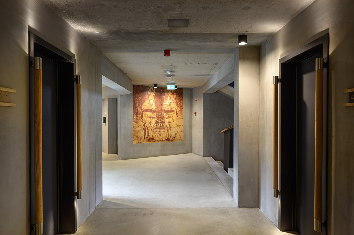 Enota designs hotel with aggressive façade made of white fences in Slovenia