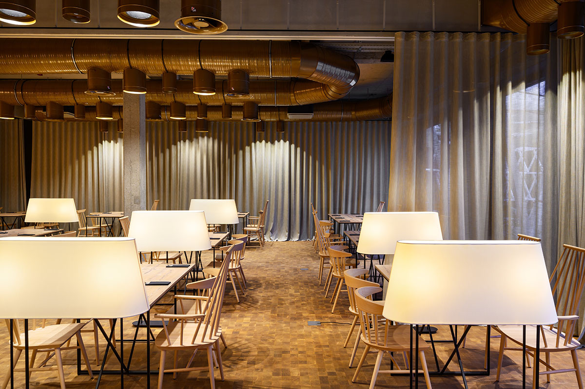 Enota designs hotel with aggressive façade made of white fences in Slovenia