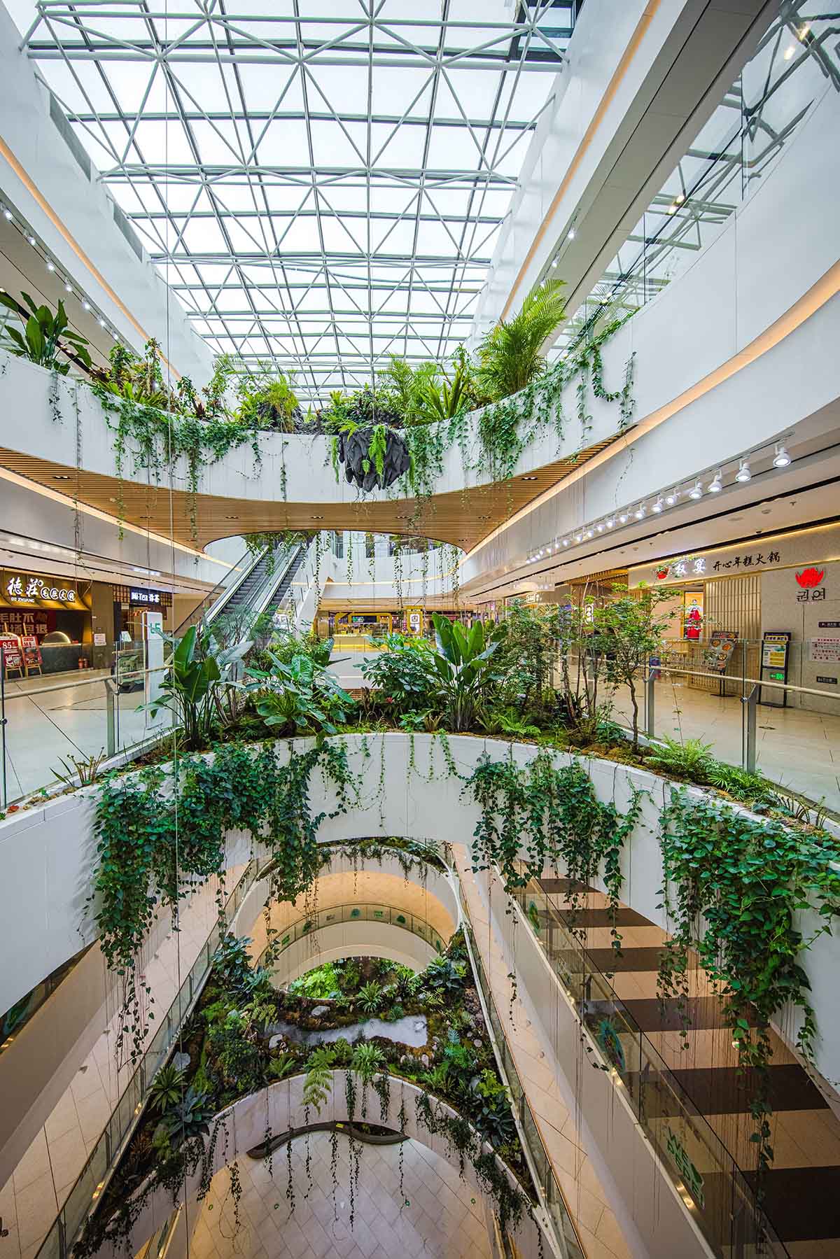 Green vertical interior design of Emquartier shopping mall dining