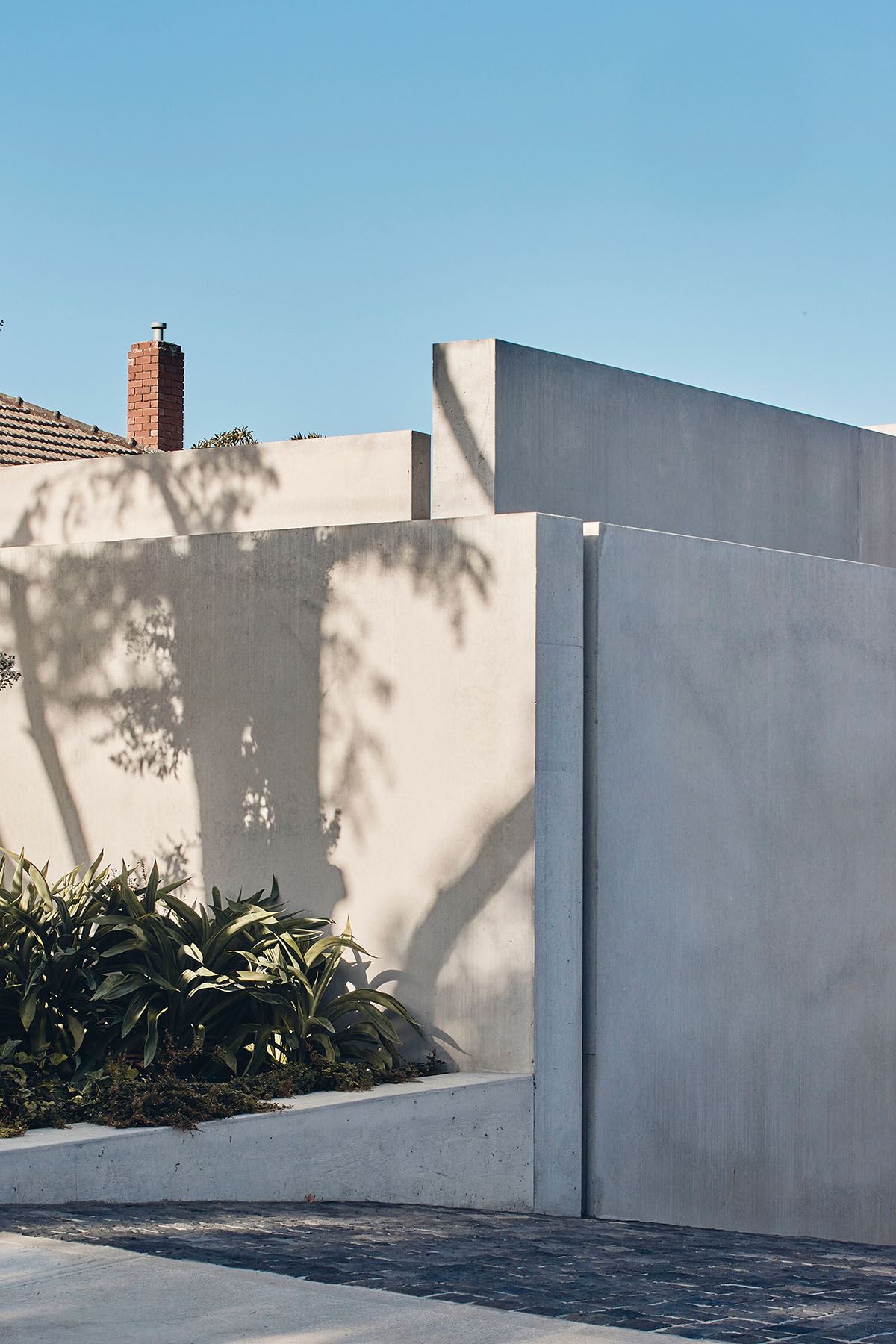 Courtyard Residence features layers of walls that heighten the sense of intrigue in Melbourne