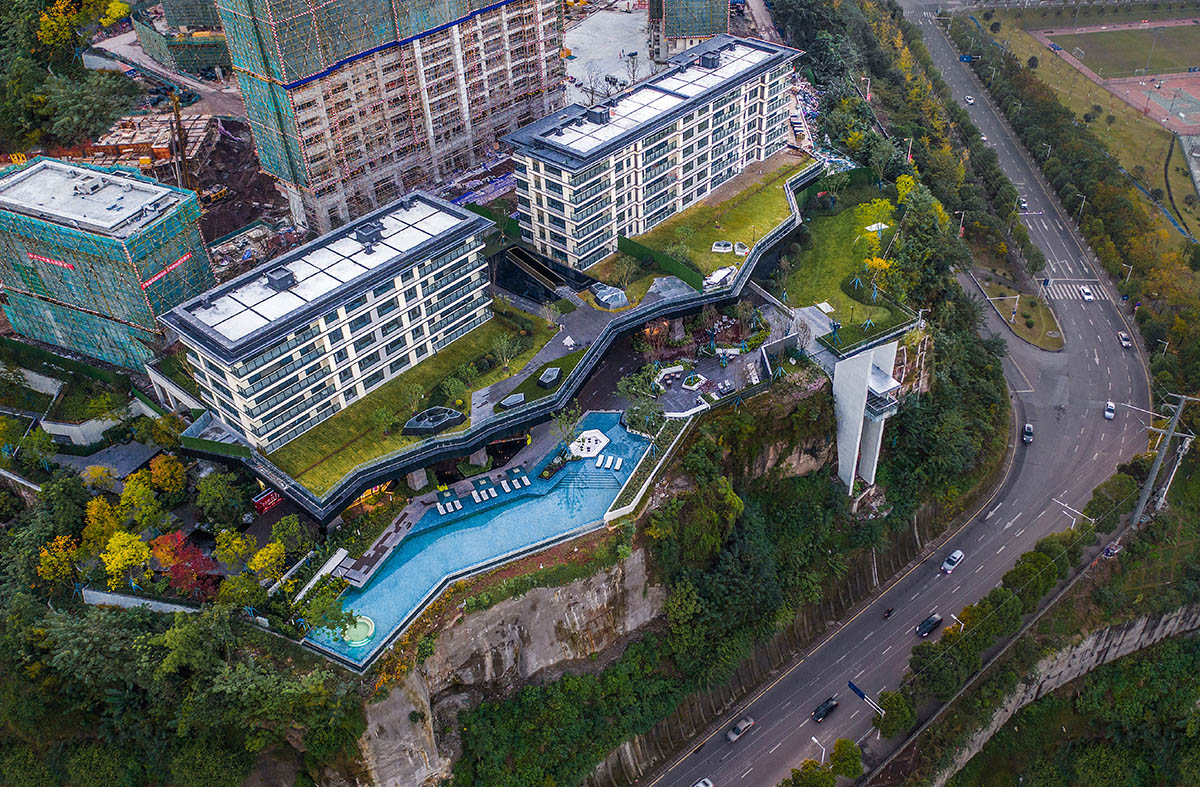 aoe completes reception center with glass polyhedron with observation tower on the edge of cliff