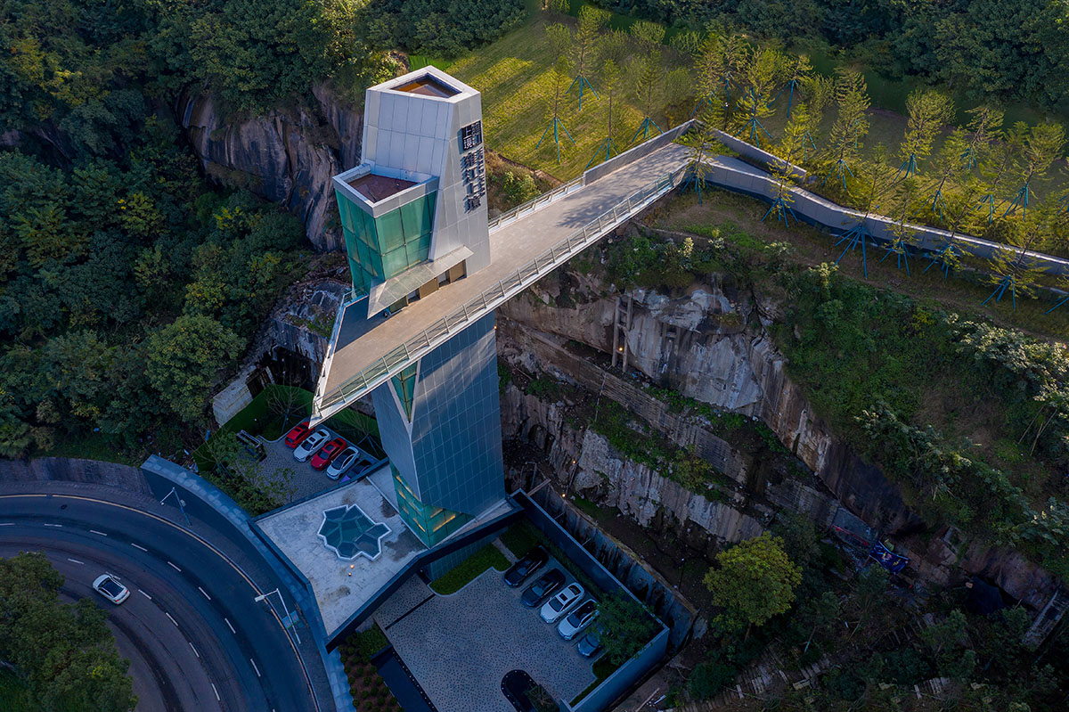 aoe completes reception center with glass polyhedron with observation tower on the edge of cliff